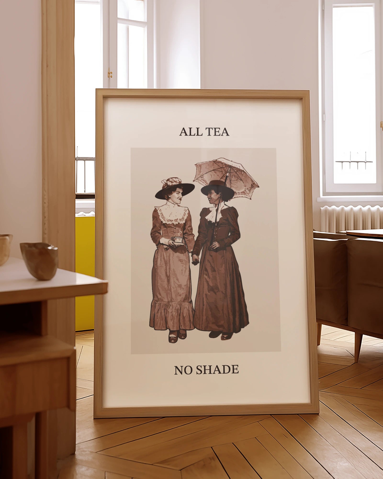 A poster with two sapphic ladies, walking together, holding hands under an umbrella, drinking tea with the text 'All Tea No Shade'.
