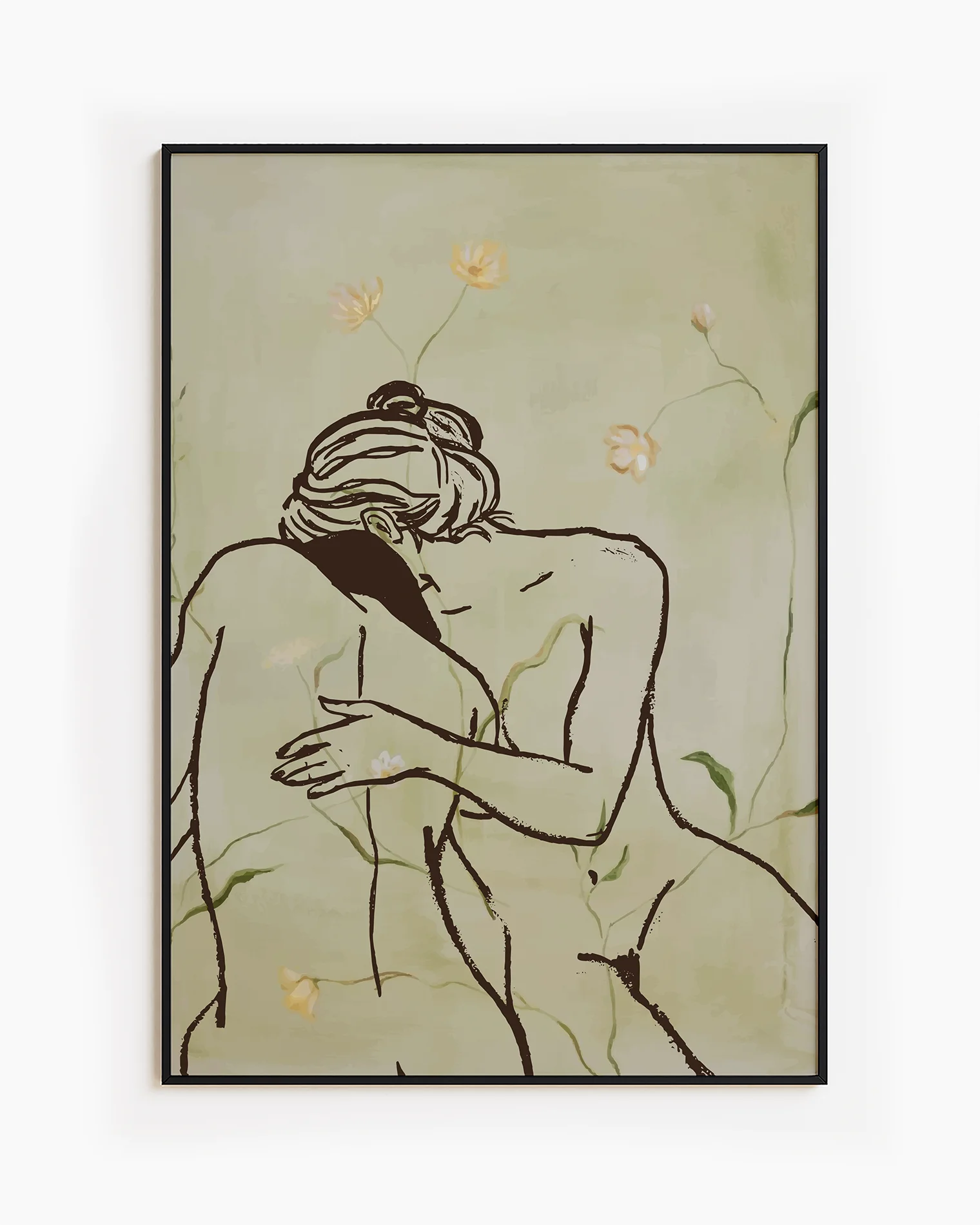 A framed print with two, naked woman holding each other in a green field.