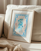 A poster that depicts two queer, muscular boxers in a romantic embrace, surrounded by red roses and a blue frame.