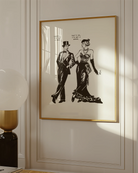 A poster featuring two androgynous characters: a woman dressed in a suit and a man in a dress, exchanging lines:
“Careful, I’m not a man.” “That’s ok, I’m not a woman.”