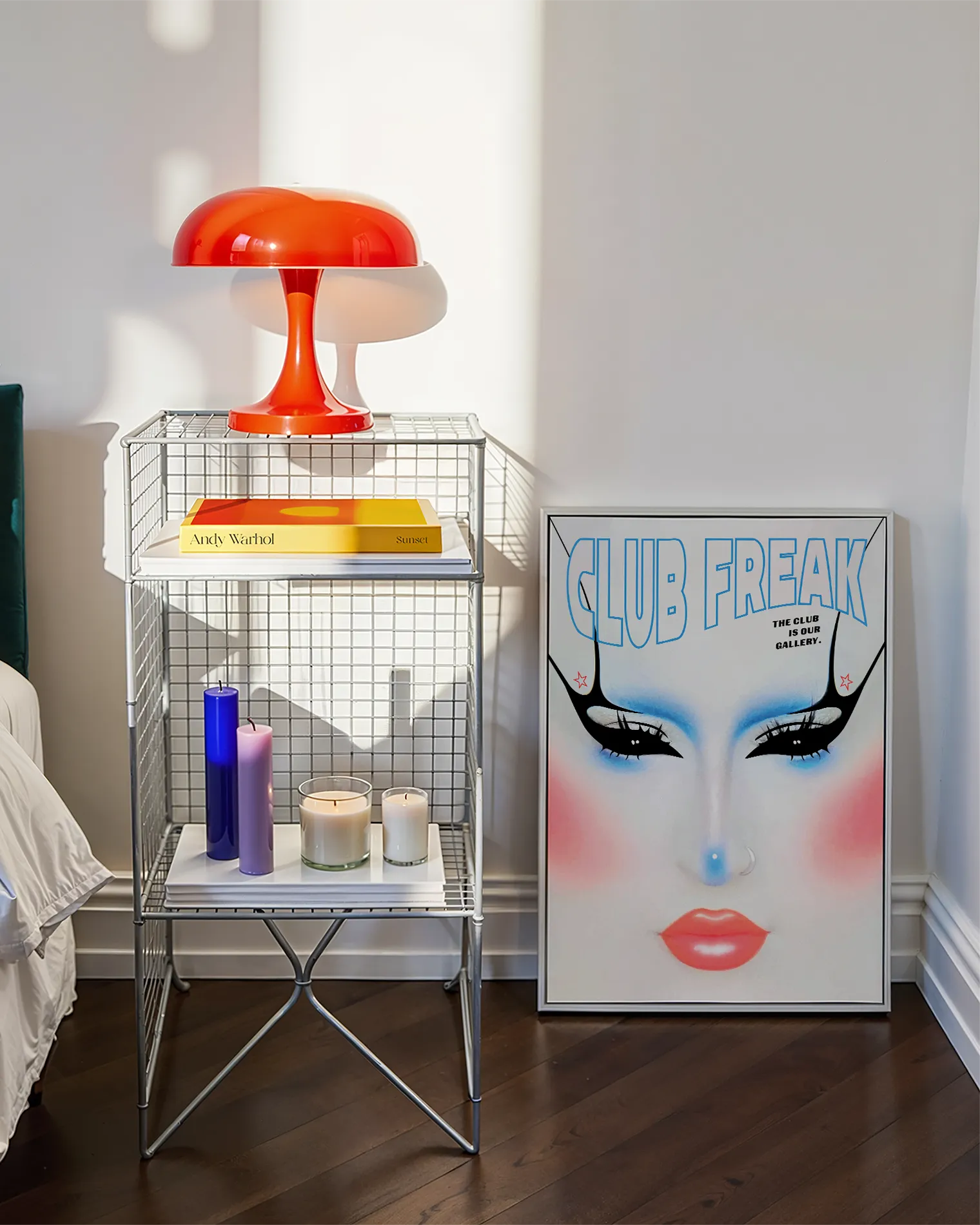 A poster with a graphic designed face in Club Kids makeup style with the text 'CLUB FREAKS'.