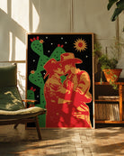 A print with two kissing cowboys under a starlit sky.