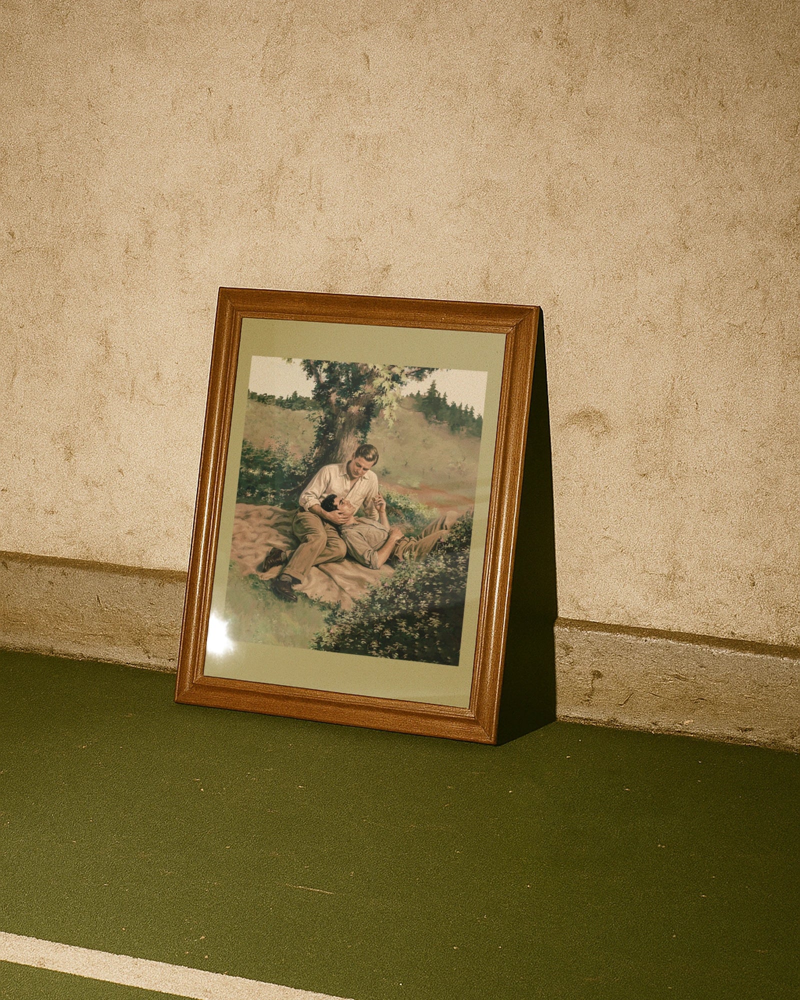 A framed poster with two men cuddling in a park. Vintage, oil painting style.