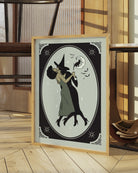 A poster with a lesbian witch couple kissing.