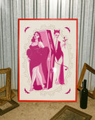 A poster with a female vampire stepping out from her coffin, while a female devil stands waiting behind, with a rose in hand. A romantic, mysterious, and intimate atmosphere.