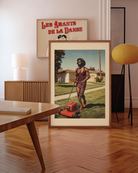 A poster featuring a fabulous drag queen in a red, glittery dress, big wig, and full makeup, mowing the lawn. The background is a charming suburban neighborhood from the 1970s, with a warm, nostalgic retro vibe.