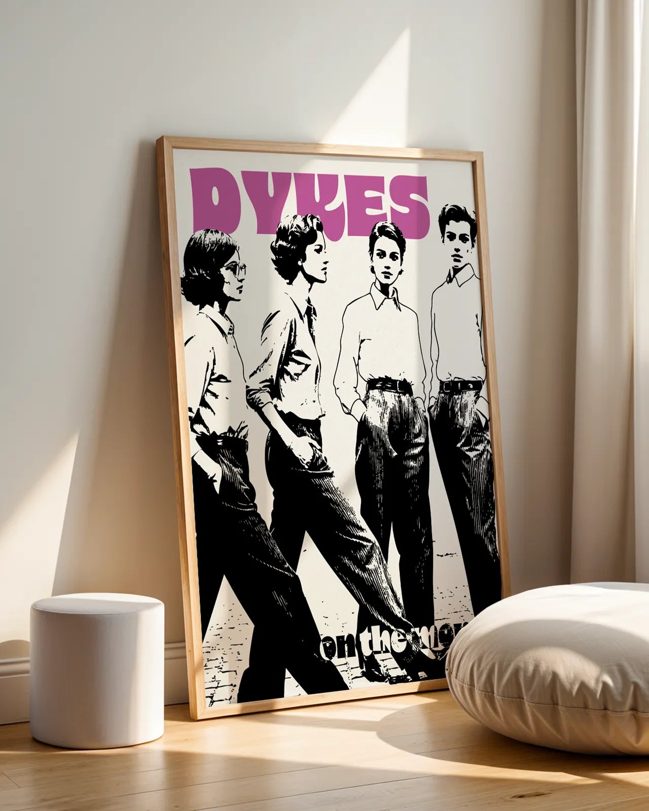 A print with four lesbian women with the text 'Dykes On The Move', in retro style.