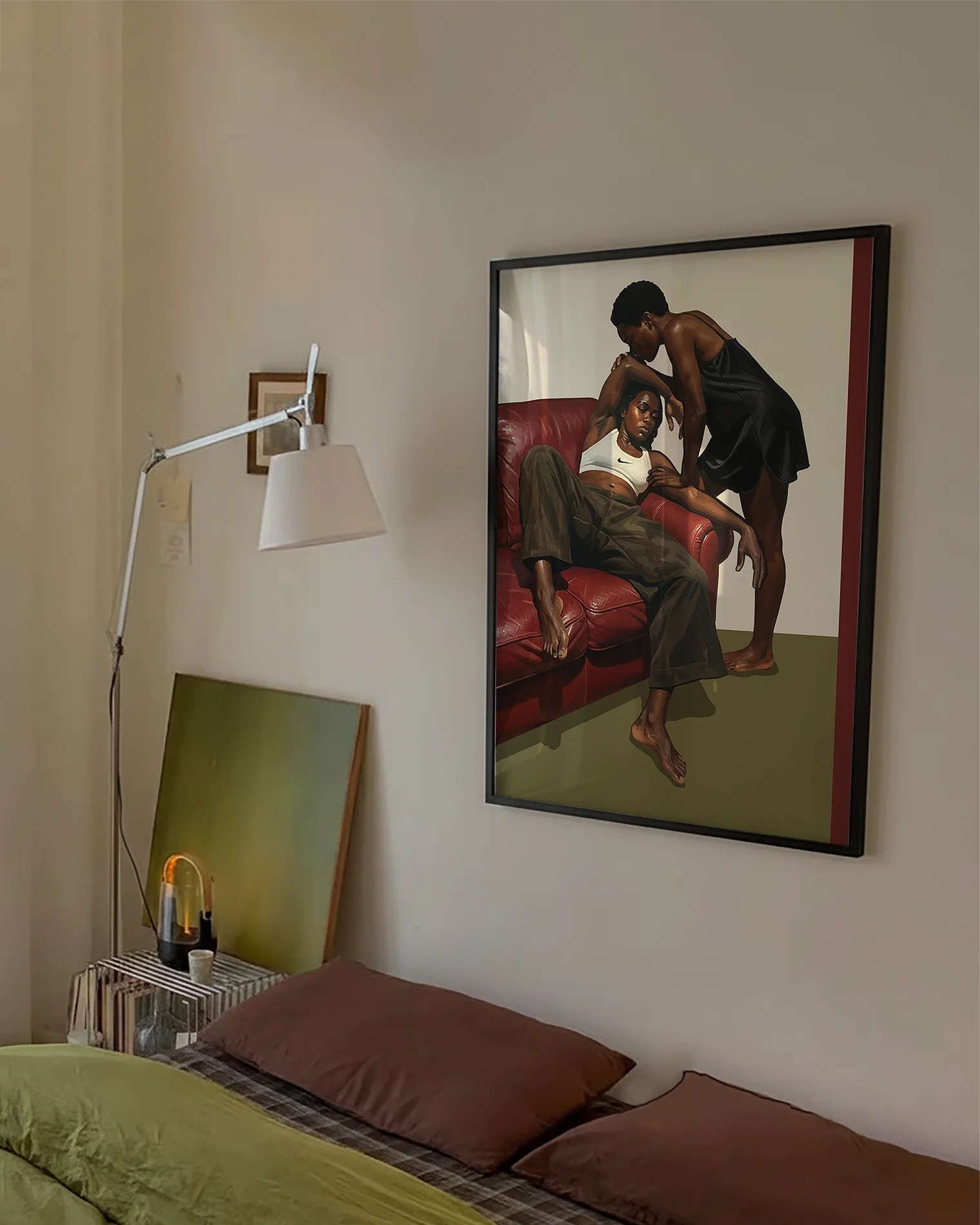A framed poster with a black, lesbian couple kissing.