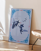 A poster featuring two lesbian witches—one flying on her broomstick while the other lies on the moon. They share a flirtatious glance, surrounded by stars and bats.