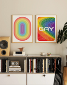 Two pride prints with a prideflag in a wavy form, with the text GAY times five.