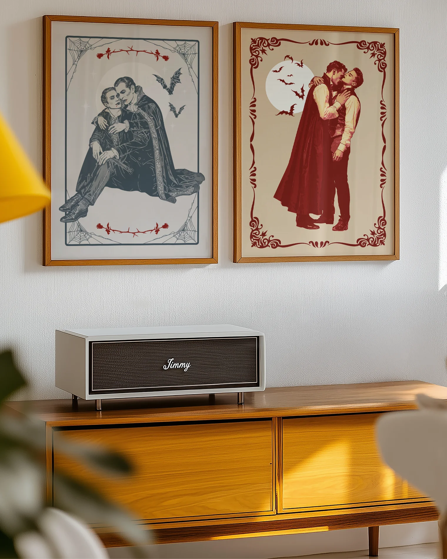 A poster depicting two male vampires embracing each other in a romantic hug, surrounded by a webbed frame, a large white moon, red roses, and flying bats.