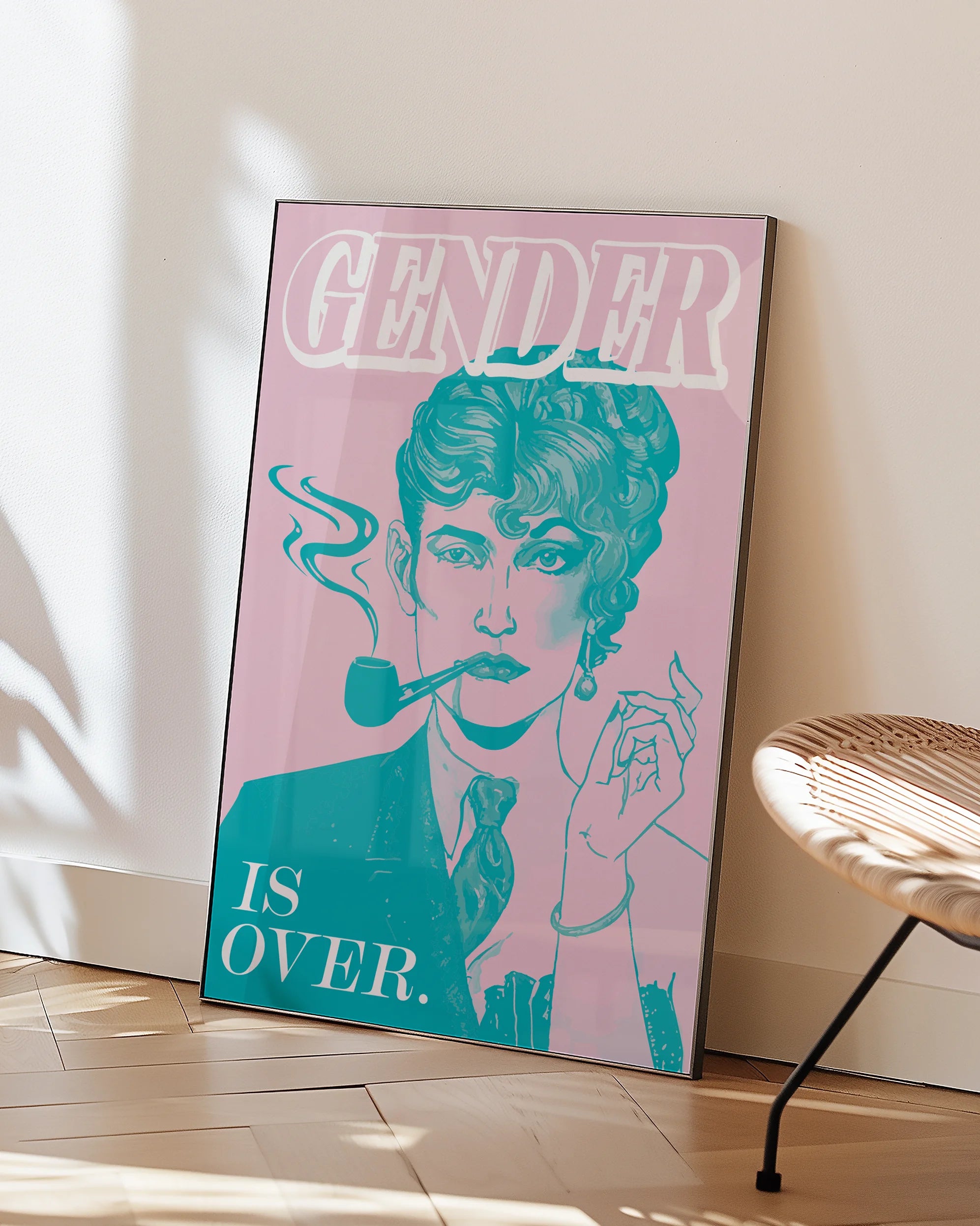 A poster featuring an androgynous person with one half of their face styled femininely and the other half masculinely, alongside the text: “GENDER IS OVER.”