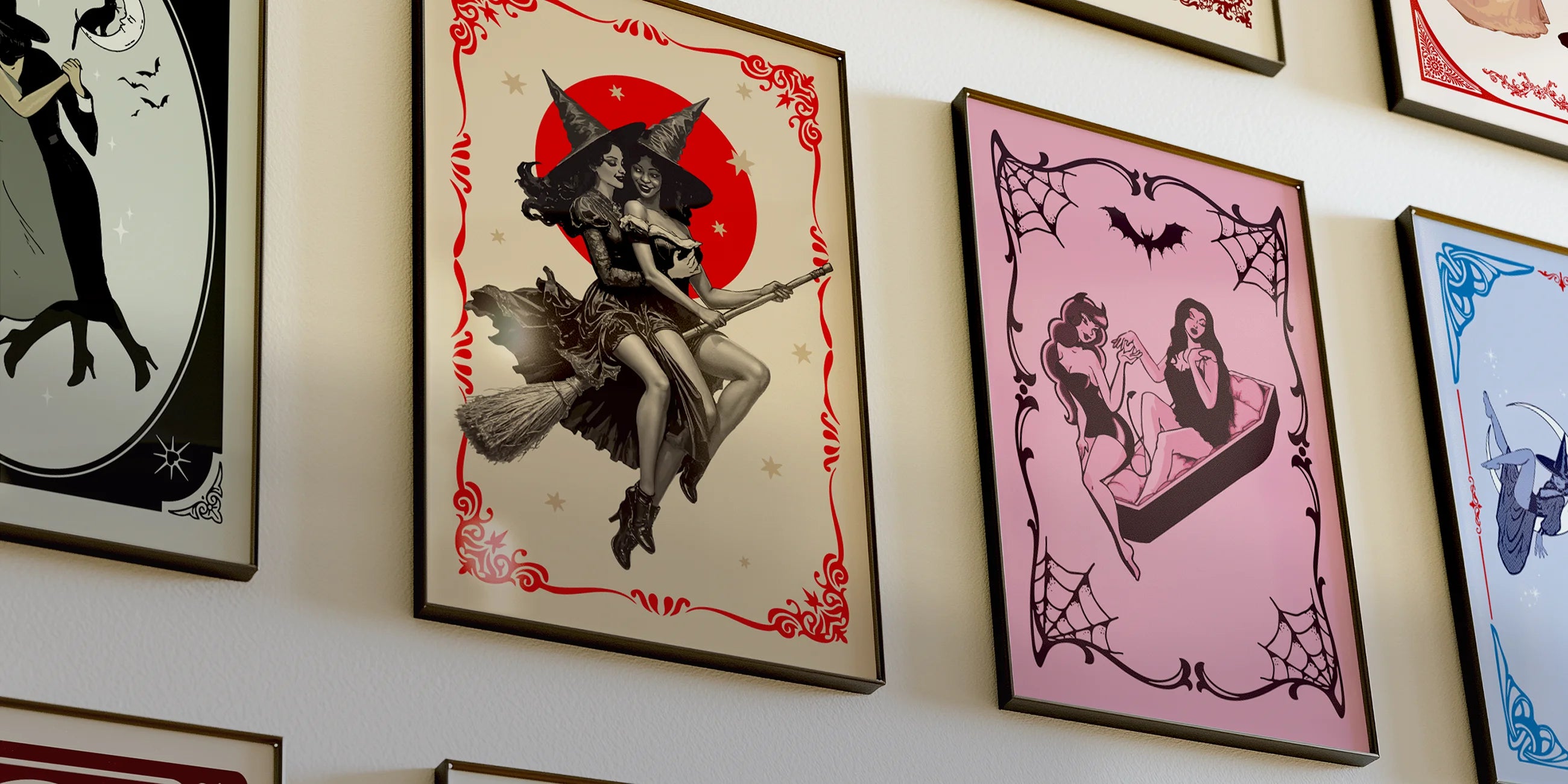 A photo of gallery wall with several framaed, queer halloween posters.