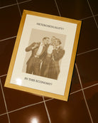 A print that shows three queer men in suits laughing together, with the text: “Heterosexuality? In this economy?”