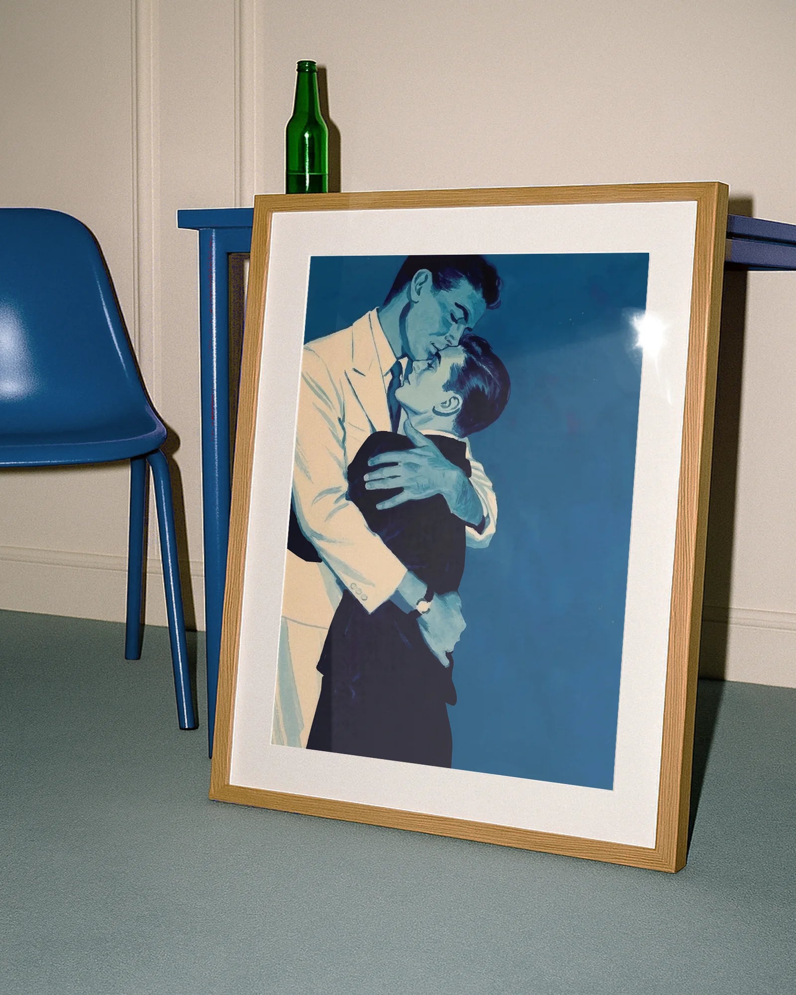 A framed print with two gay men hugging tightly, vintage 1940's style.
