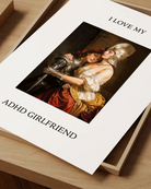 A poster showing a woman leaning against her girlfriend’s chest, both dressed in silver armor, with the text: “I LOVE MY ADHD GIRLFRIEND.”