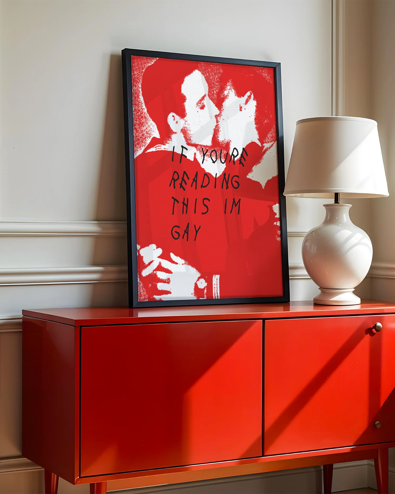 A poster with two illustrated men in uniforms kissing, with the text 'If you're reading this I'm gay'.