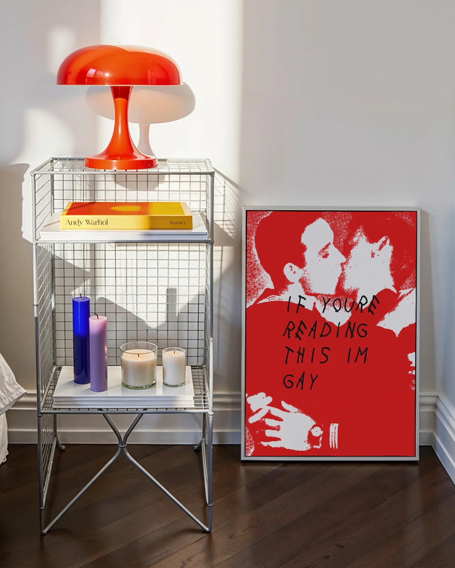 A poster with two illustrated men in uniforms kissing, with the text 'If you're reading this I'm gay'.