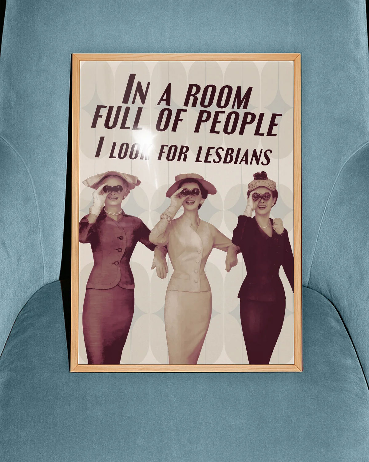 A poster with three ladies in vintage style holding binoculars with the text 'In a room full of people, I look for lesbians'.