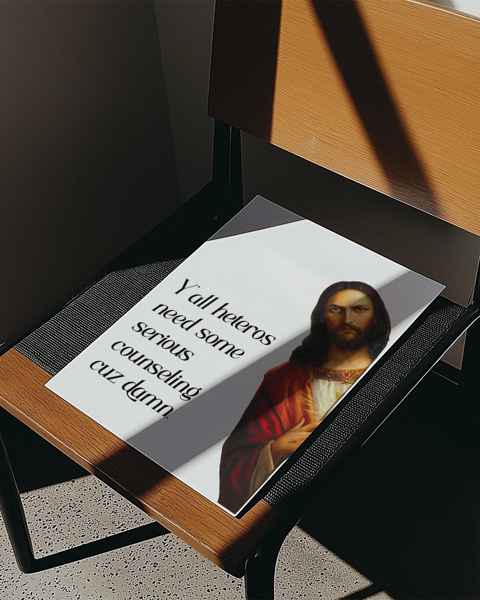 A framed poster with Jesus saying "Y'all heteros need some serious counseling cuz damn."
