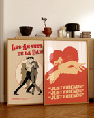 A poster with two illustrated, gay men hugging tight, with the text 'JUST FRIENDS'.