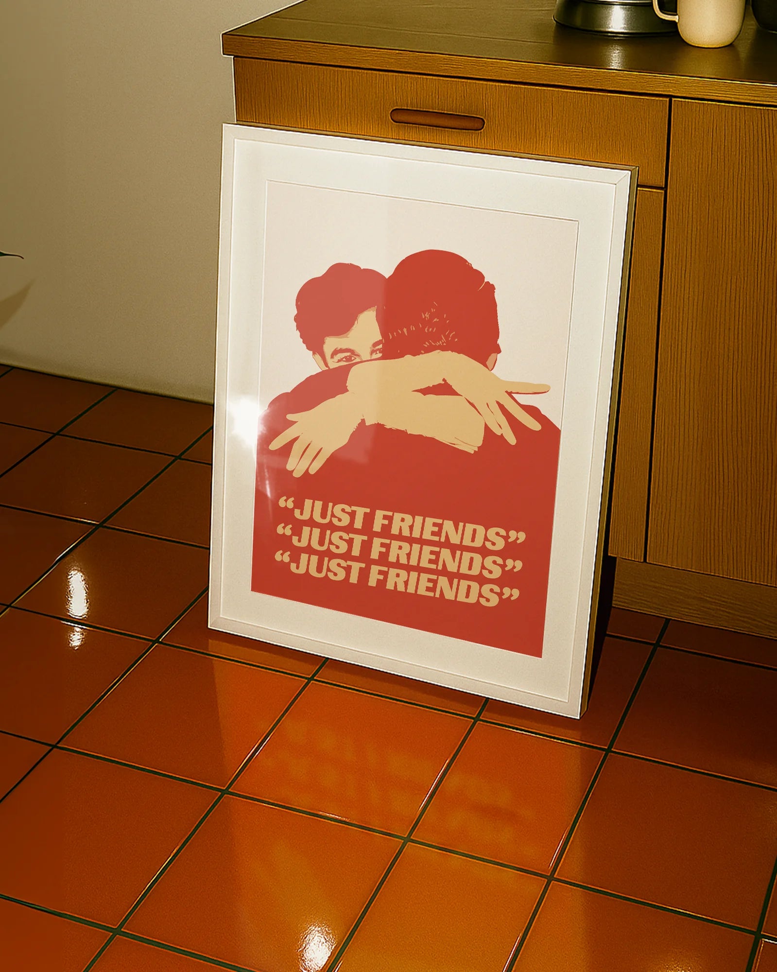 A poster with two illustrated, gay men hugging tight, with the text 'JUST FRIENDS'.