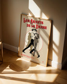 A vintage poster with two illustrated gay men dancing, with the text 'Les Amants De La Danse'.