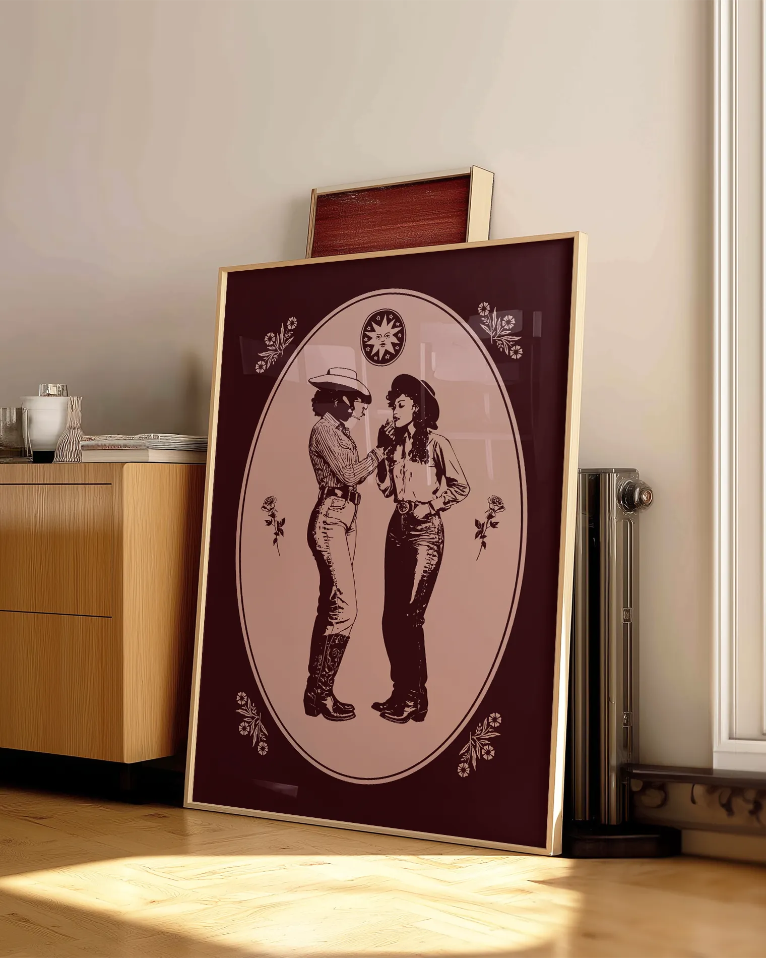 A framed print with a lesbian cowgirl couple.