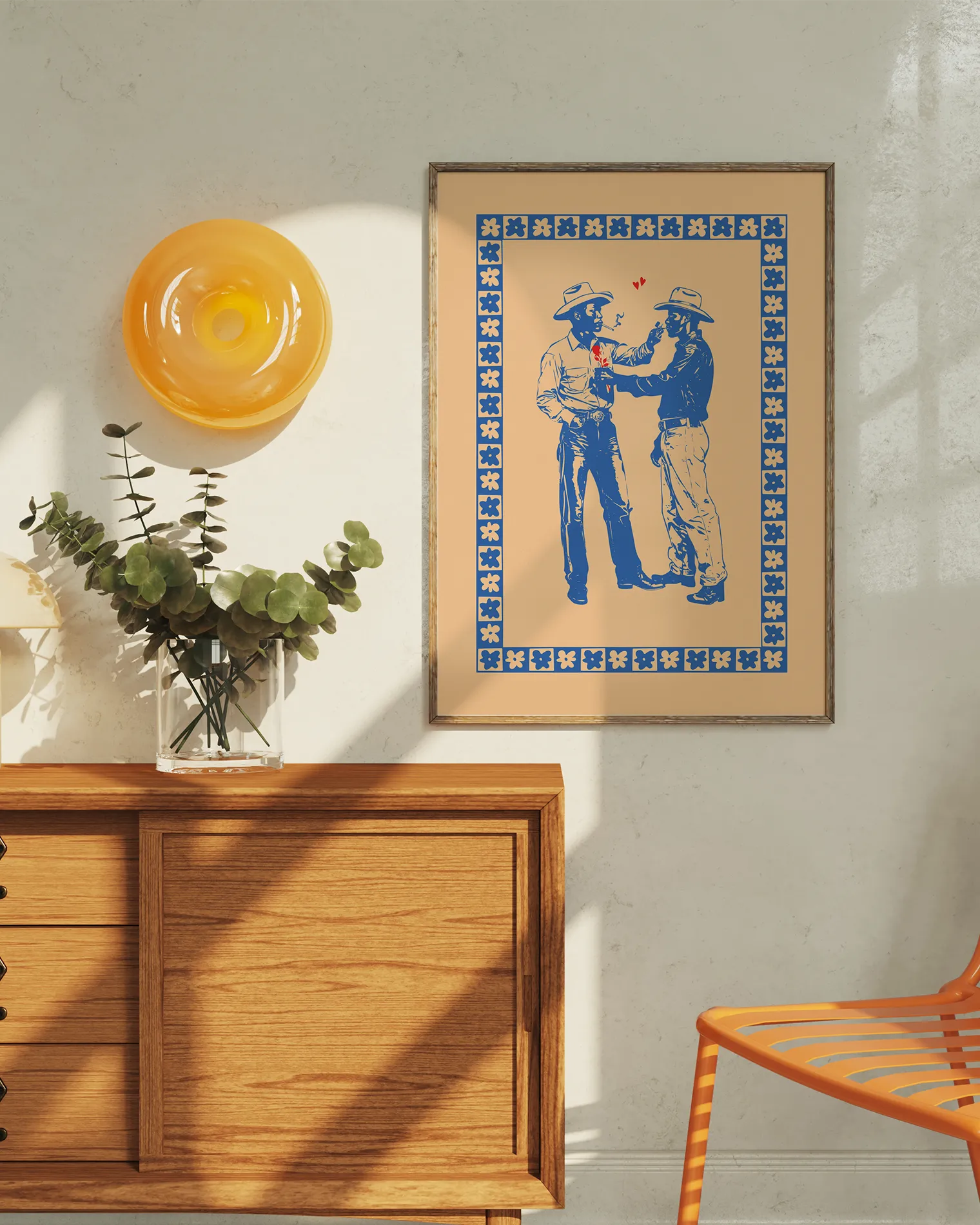 A print with two illustrated cowboys in love, against a beige background.