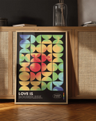 A print with the classic pride flag colours in abstract, rounded forms with the text 'Love Is Boundless.'