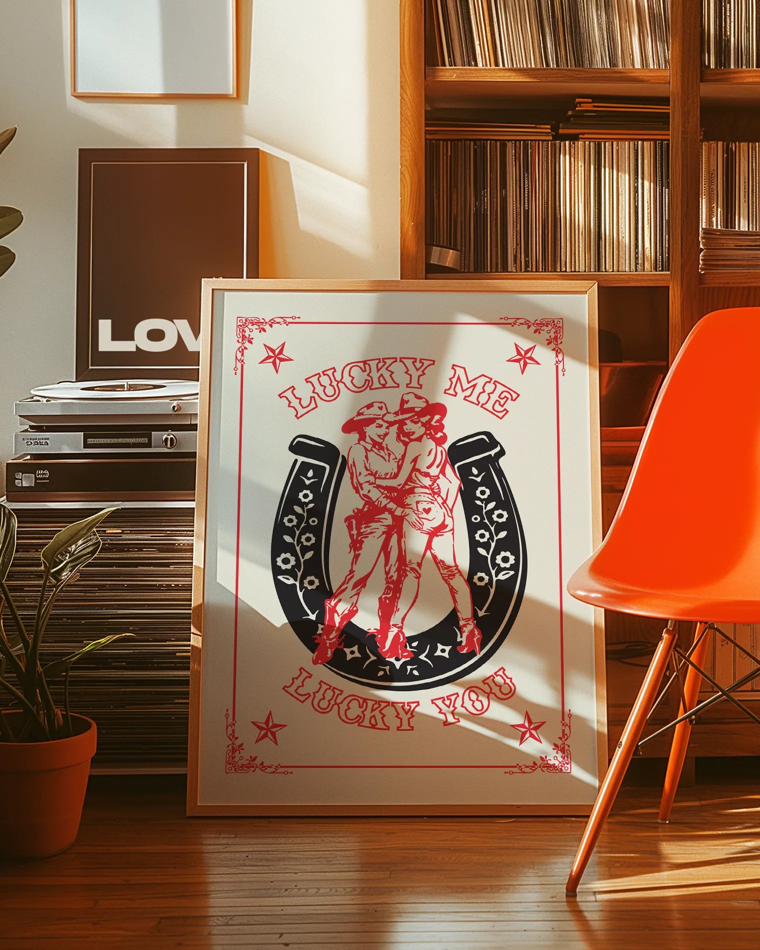 A print with an illustrated, lesbian cowgirls couple with the text 'Lucky me Lucky you.'