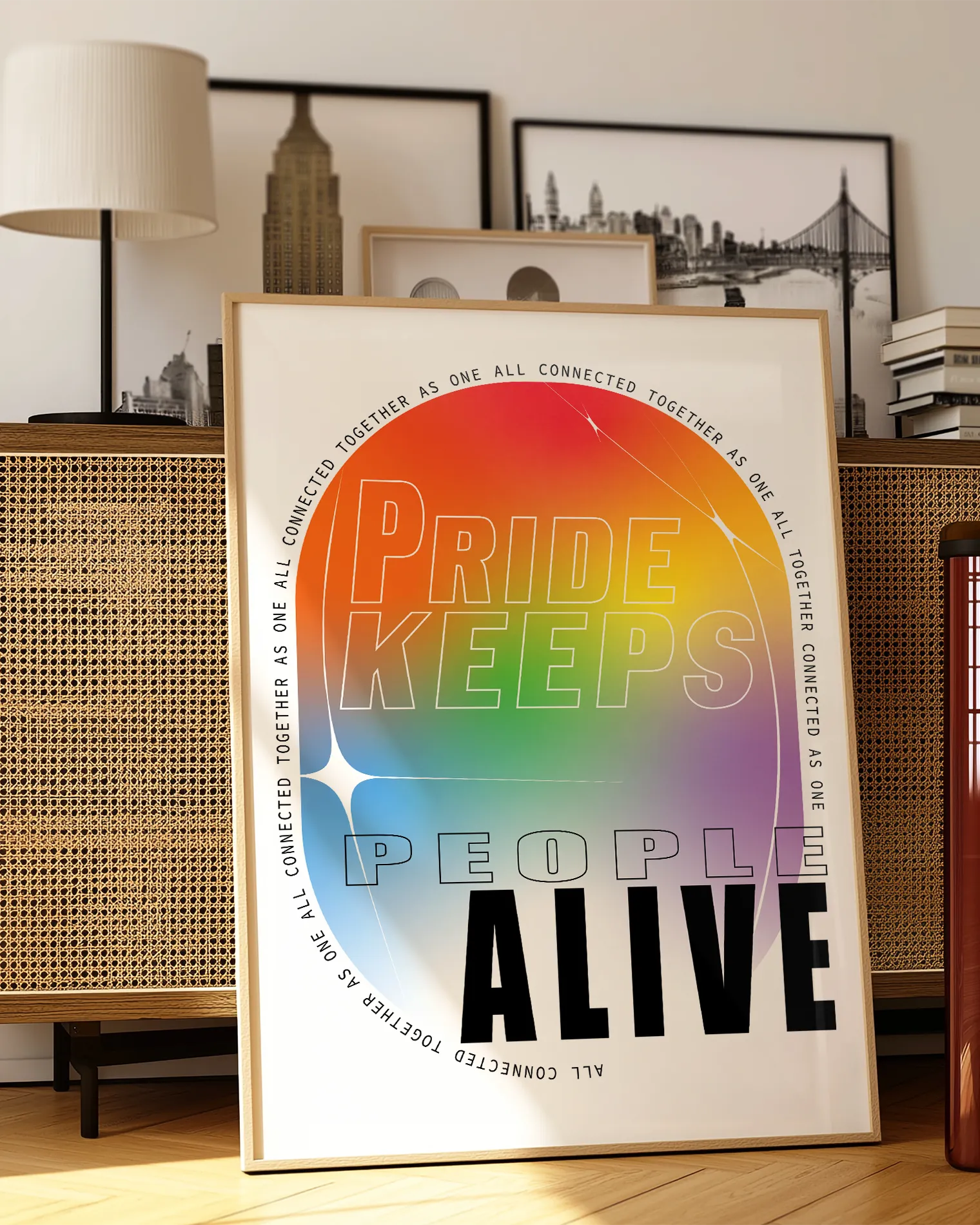 A print with the classic pride colours in an oval shape with the text 'Pride Keeps People Alive'.