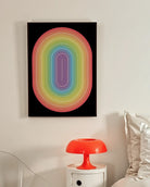 A framed print with an illustrative prideflag in an oval form.