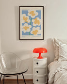 A print with retro flowers and a queer poem.