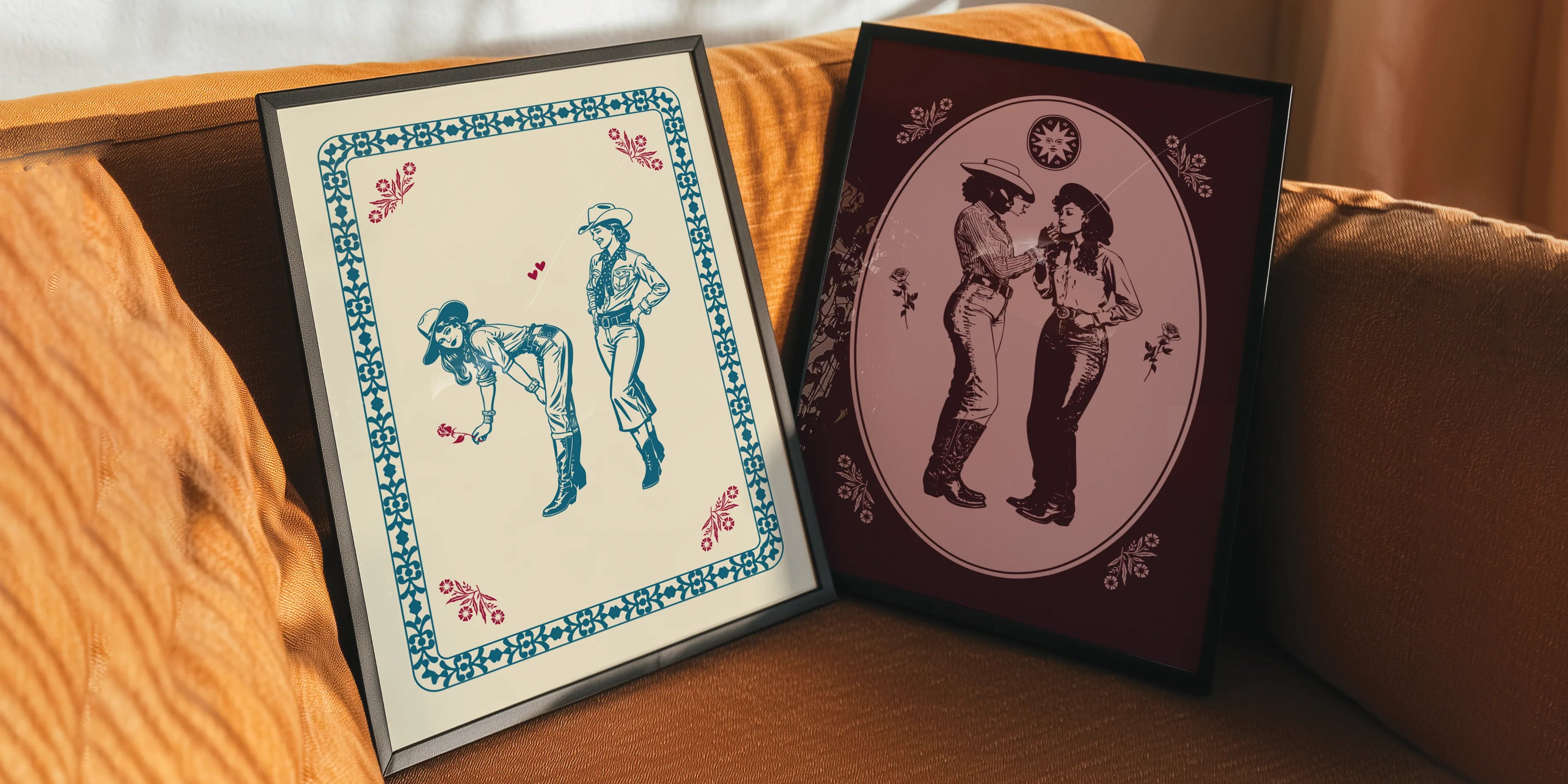 A gallery wall with two sapphic themed prints.