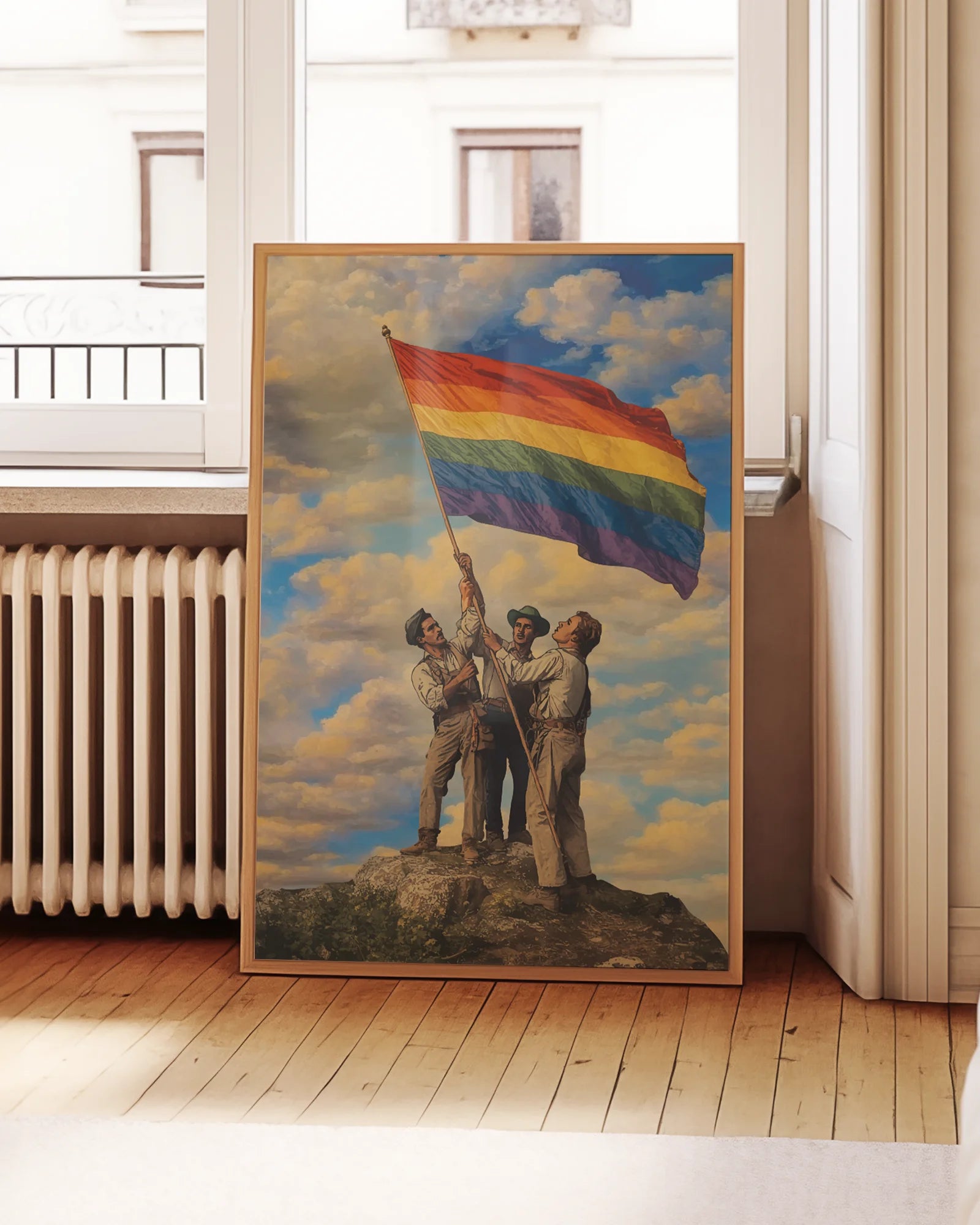 A framed poster with three gay men raising a Pride flag together, symbolizing unity, courage, and the ongoing fight for LGBTQIA+ rights.