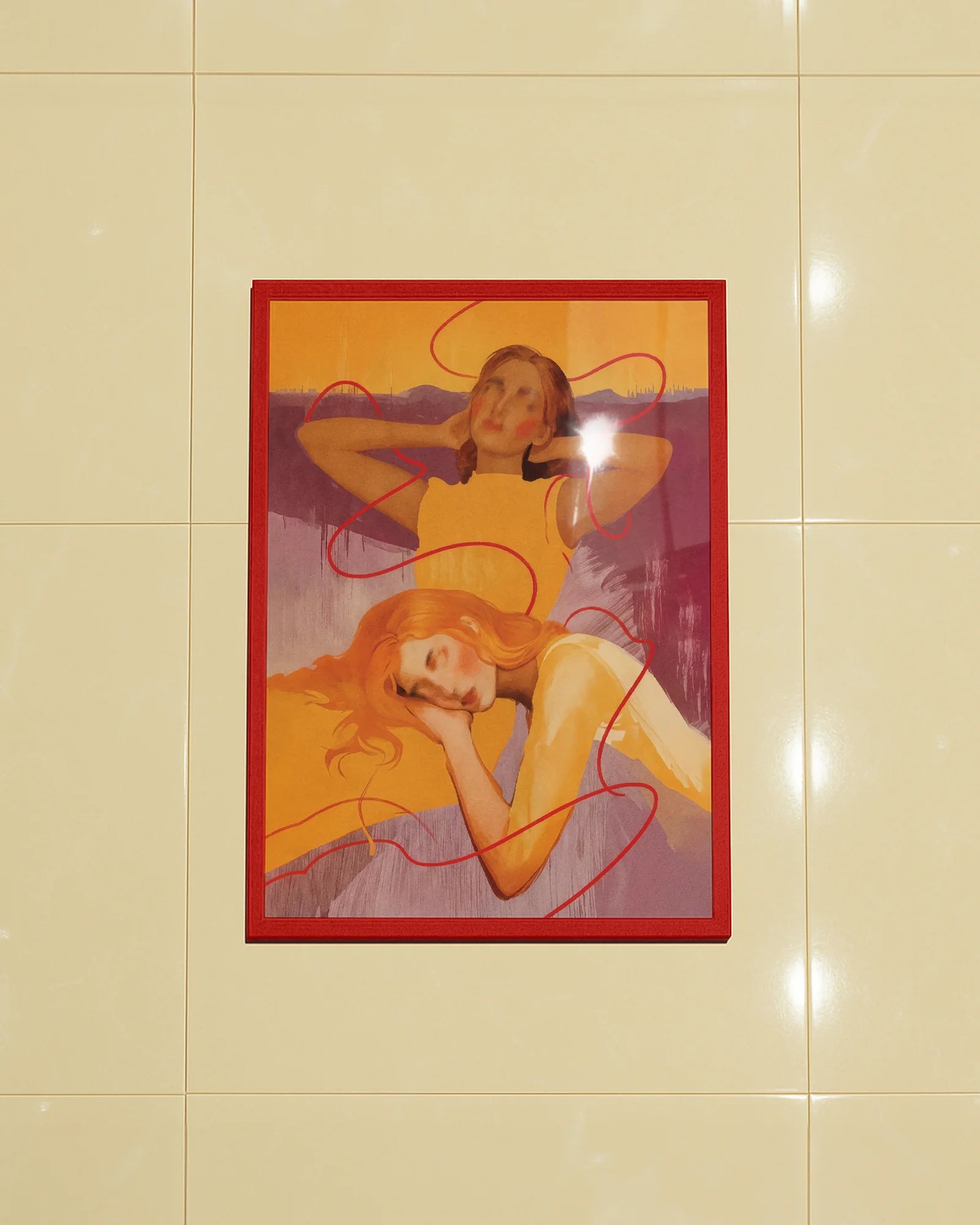 A framed poster with a lesbian, abstract couple.