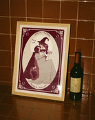 A poster with two lesbian witches kissing.