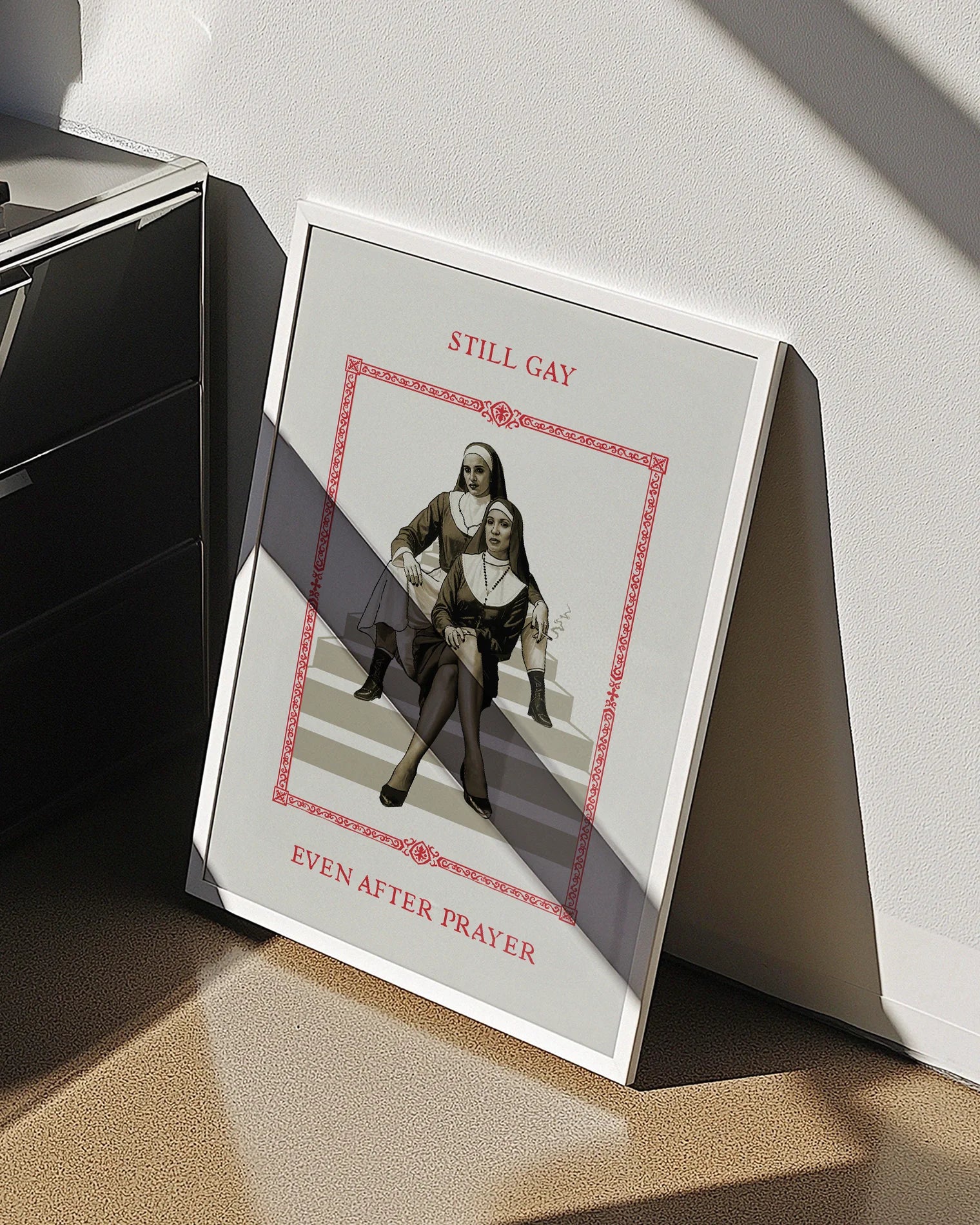 A poster featuring two rebellious nuns sitting on a staircase in a confident pose, with the text: “STILL GAY, EVEN AFTER PRAYER.”