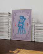 A poster that features two muscular queer boxers in a romantic embrace, surrounded by red roses and a purple frame.