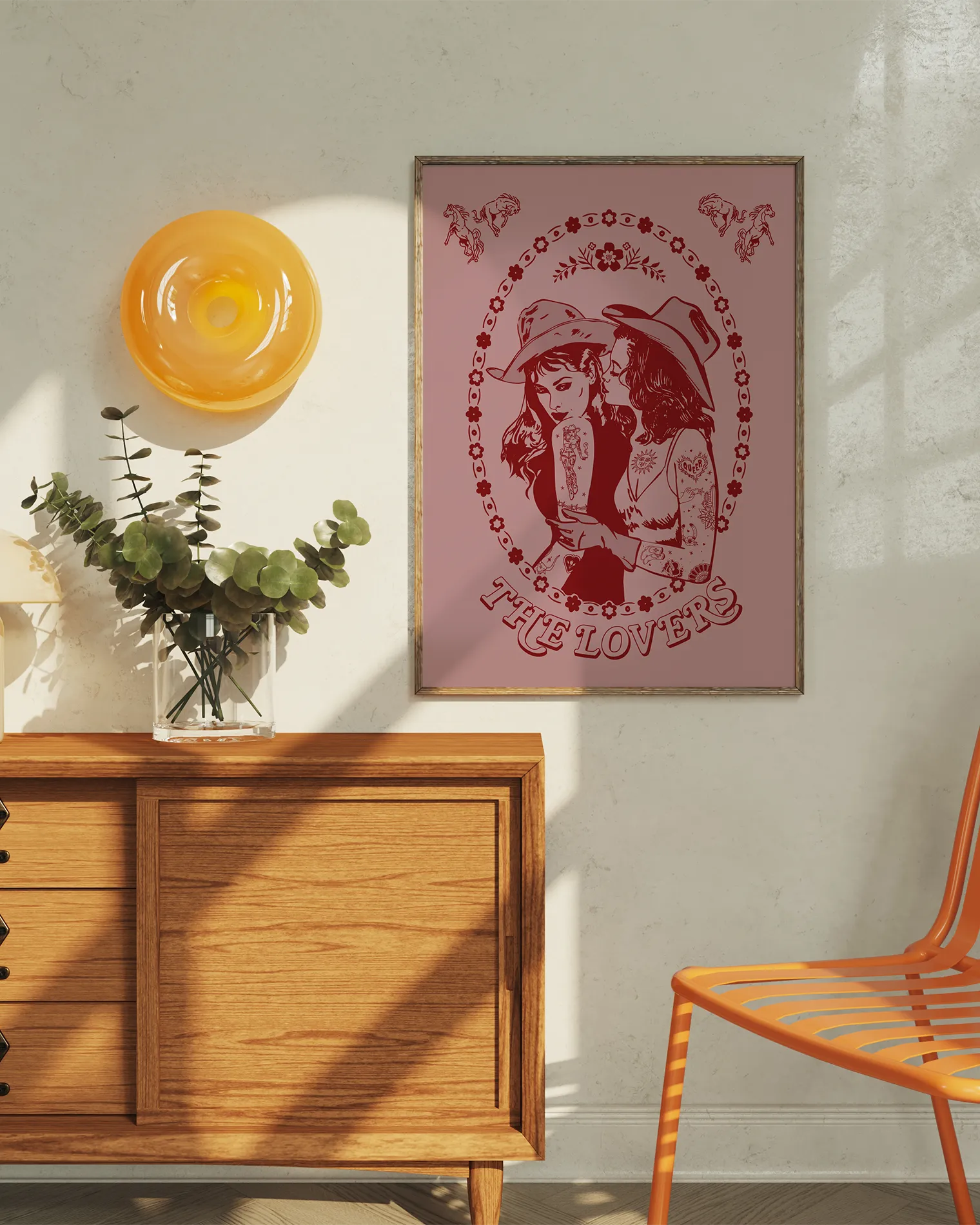 A print with a lesbian cowgirl couple kissing with the text 'The Lovers'.