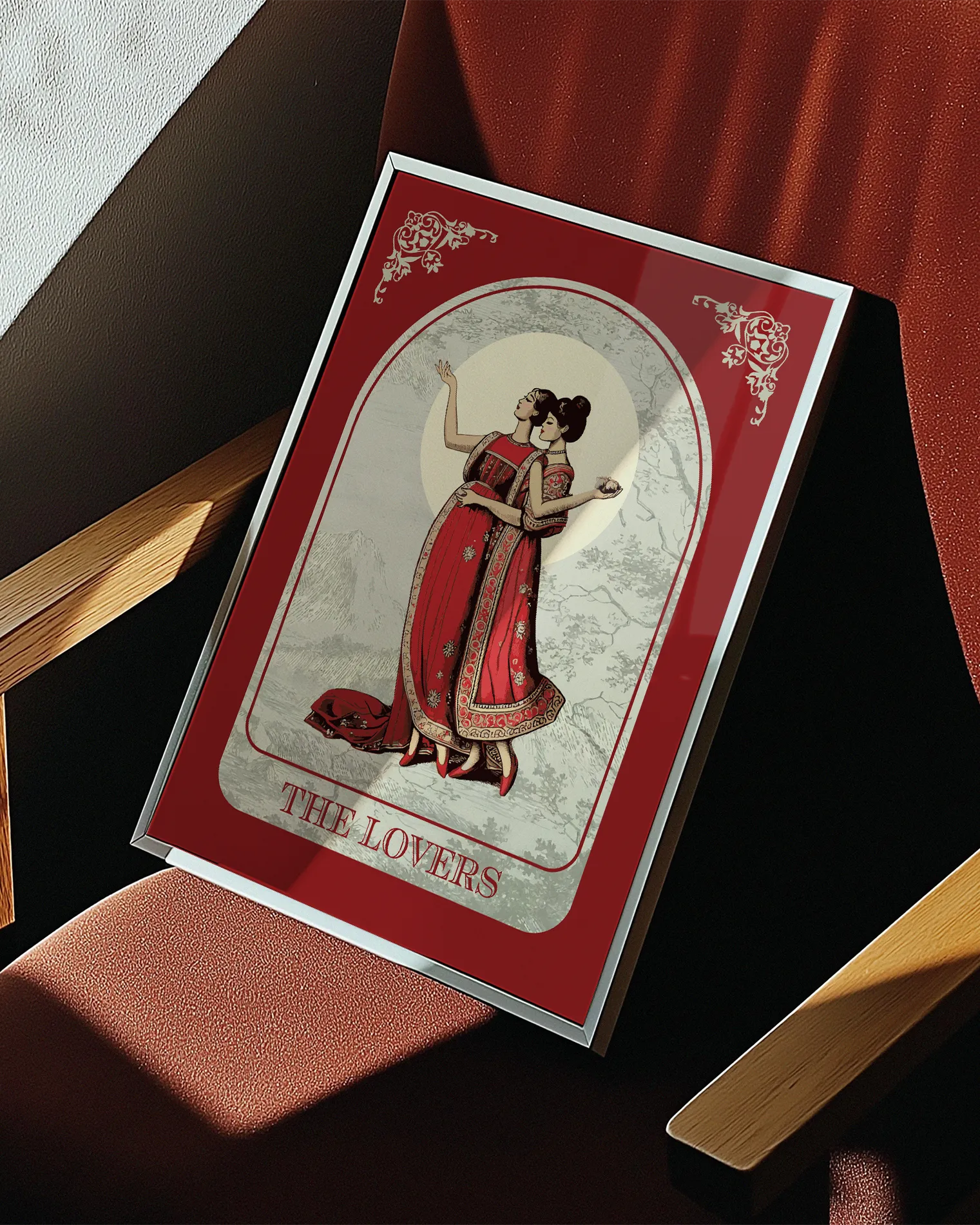 A poster with an illustrated, sapphic couple in the 1700's, posing in red dresses with the text 'The Lovers'.