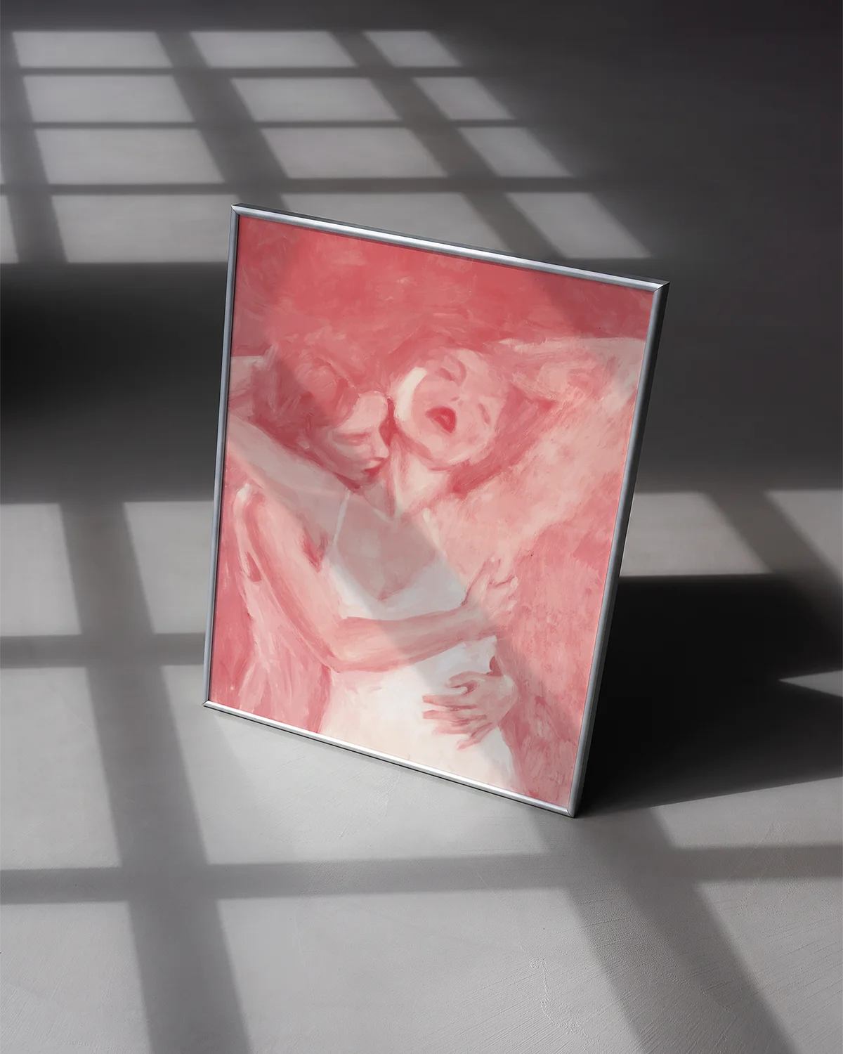 A poster with two ladies hugging, abstract and pink.