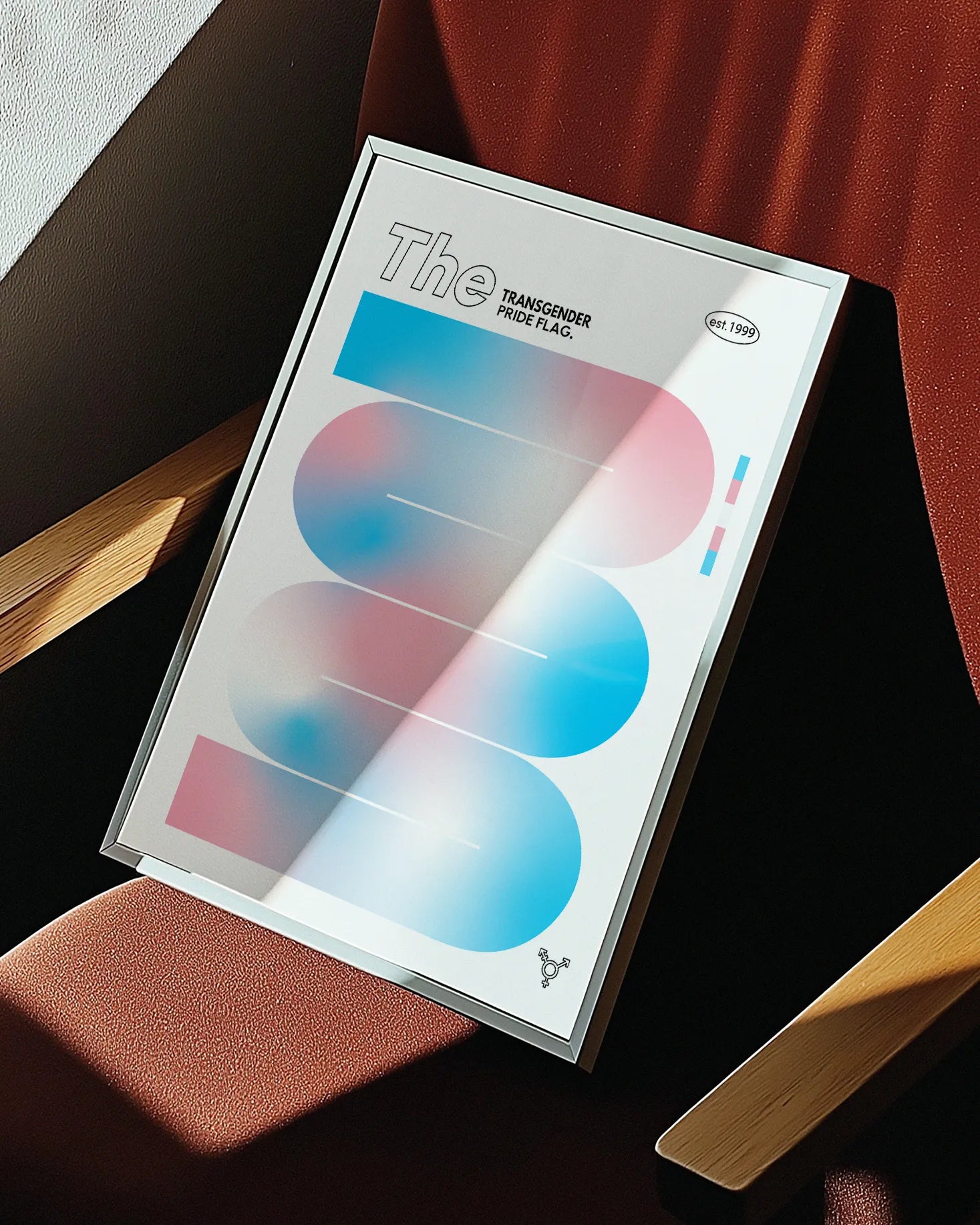 A print with the Transgender Pride Flag in a soft shape.