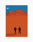 A framed print with a couple in suits, walking hand in hand in a desert.