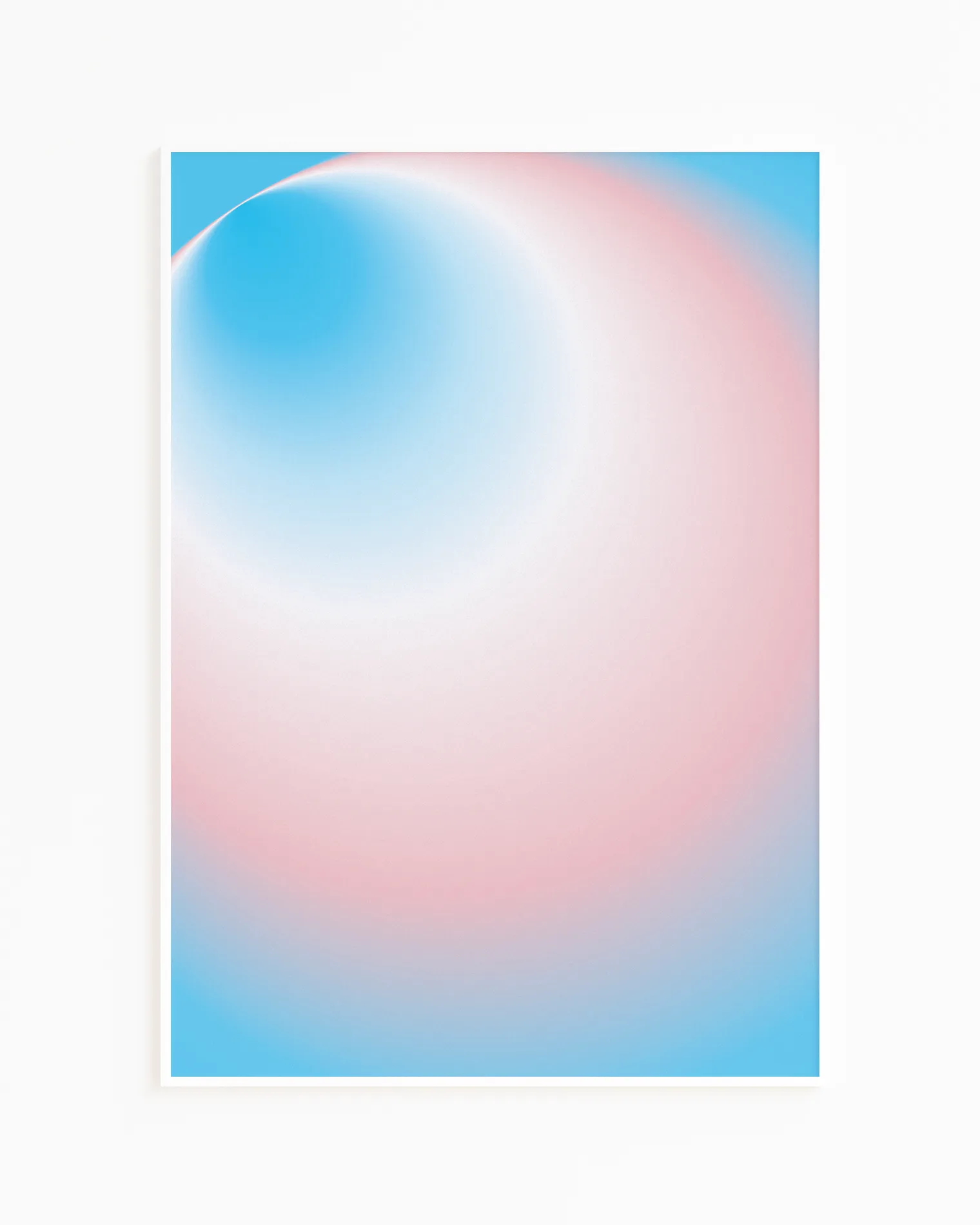 A framed print with a round, gradient form in the transflag colours blue, pink and white.