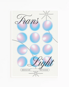A print with the text 'Trans Light', against a background with gradient circles in the transgender flag colours.