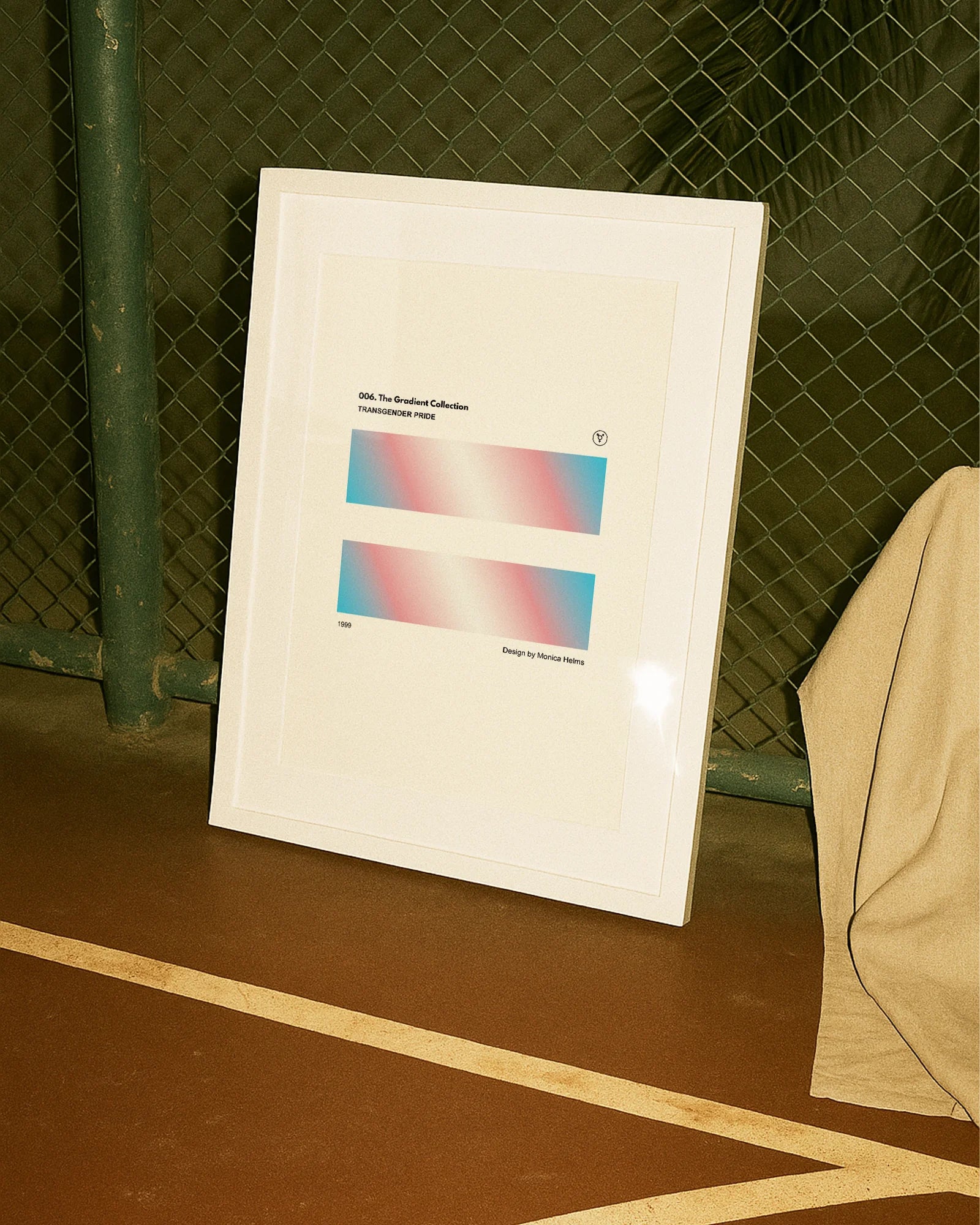 A print with the Transgender pride flag in two, rectangular, gradient blocks, with the text 'Transgender Pride´ and 'Design by Monica helms, 1999.'