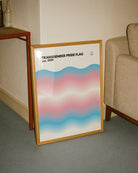 A print with the Transgender pride flag in a wavy, abstract form together with the text 'Transgender Pride Flag est. 1999.'