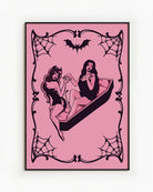 A poster featuring a female devil sitting on the edge of a coffin, while a female vampire sits inside. They hold each other’s hands romantically, creating a mysterious and intimate atmosphere.